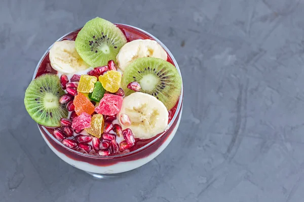 Homemade yogurt with fruits in glass top view — Stock Photo, Image