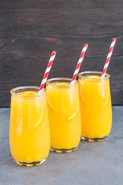 Three glasses of delicious citrus juice — Stock Photo, Image