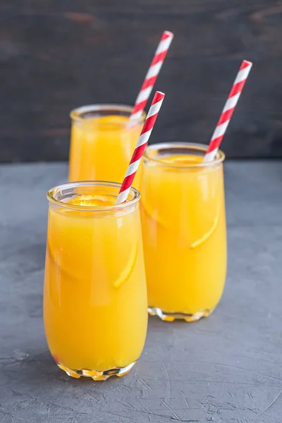 Three glasses of delicious citrus juice — Stock Photo, Image