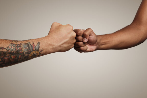 Friends do a fist bump