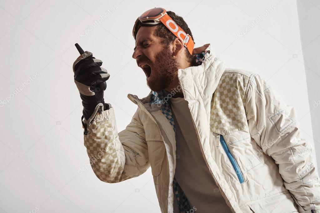 Man in snowboard gear screaming