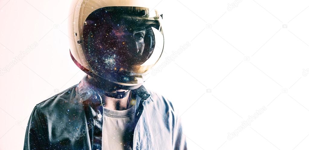 man in helmet with starry sky projected on shield