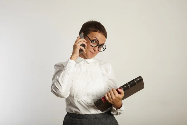 Female teacher talking on phone — Stock fotografie