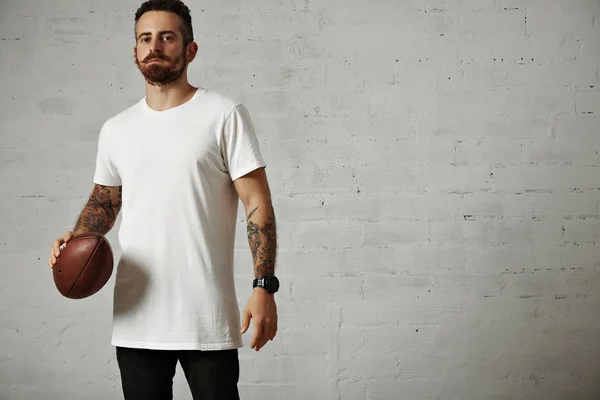 Man holding vintage rugby ball — ストック写真