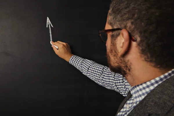 Teacher starting to draw graph on blackboard — ストック写真