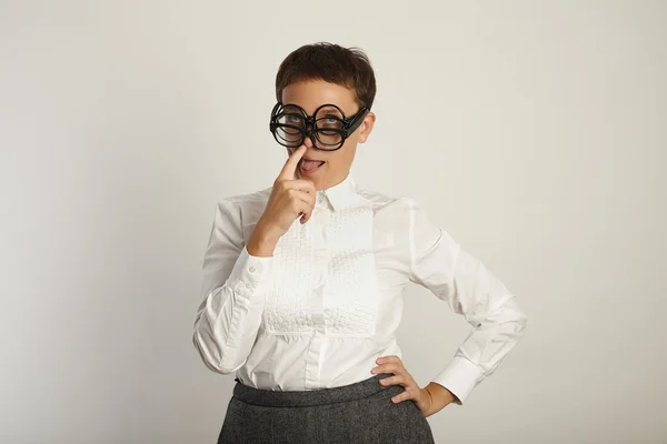 Teacher sticks out tongue and picks nose — Stock fotografie