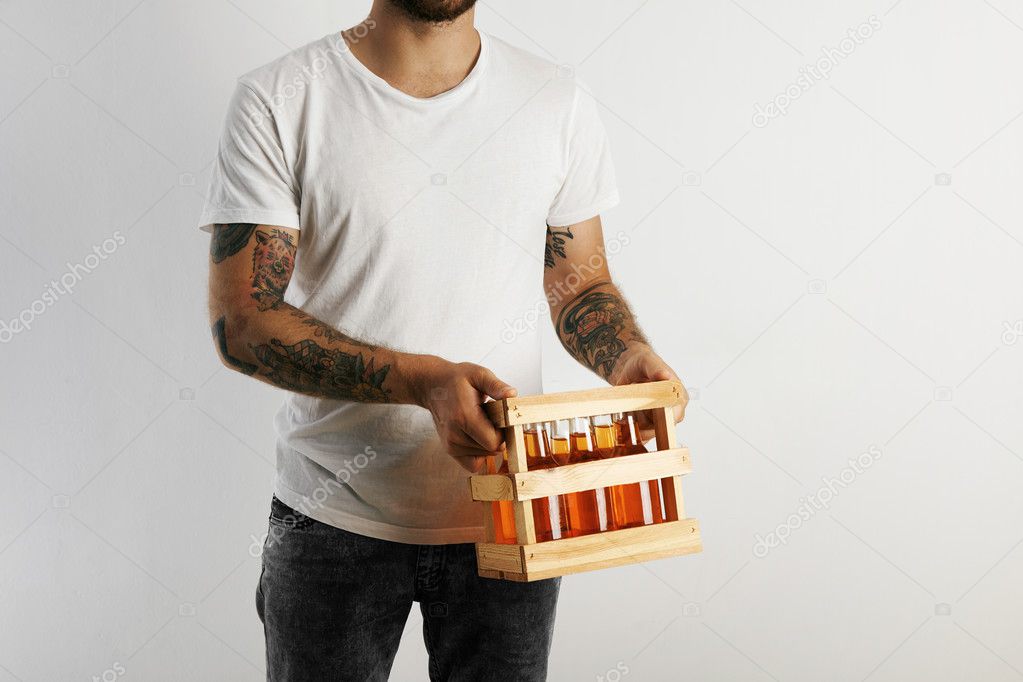 man holding crate of artisan beer