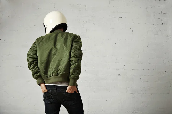 Motorcyclist in white helmet and green jacket — Stock Photo, Image