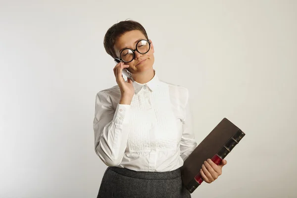 Bored female teacher talking on phone — Φωτογραφία Αρχείου