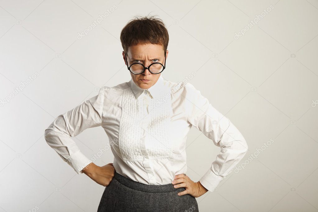 Angry female teacher in glasses