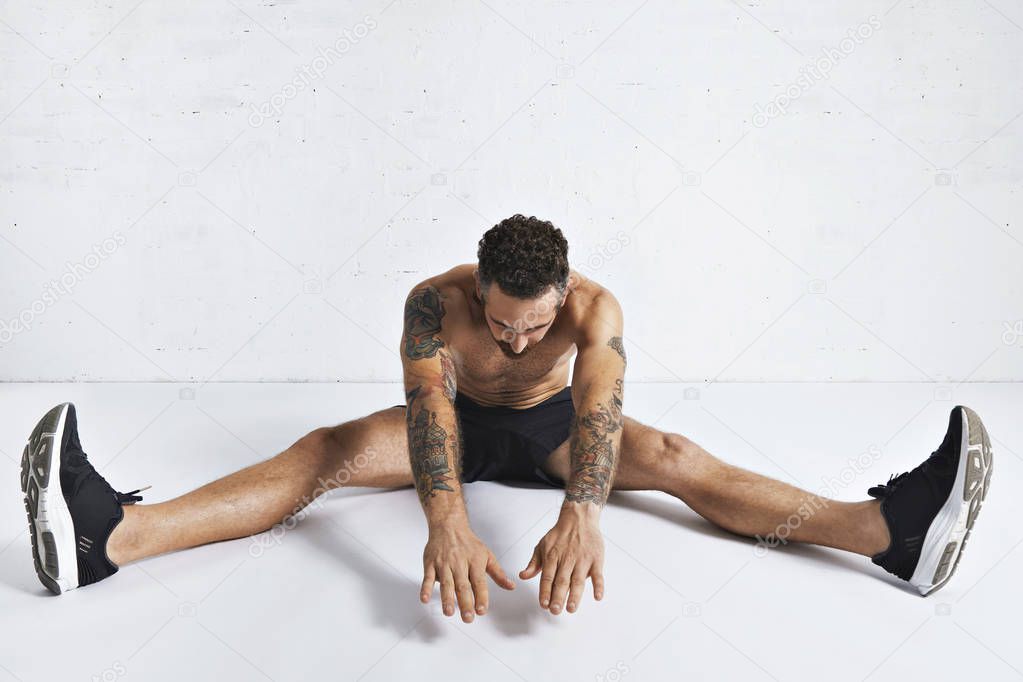 Stretching fitness routine in white room