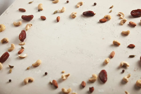 Dried fruit and nuts on old table — Stock Photo, Image