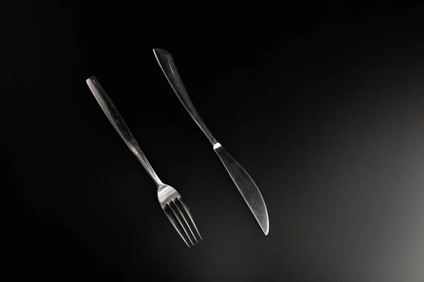 Fork and  knife on black — Stock Photo, Image