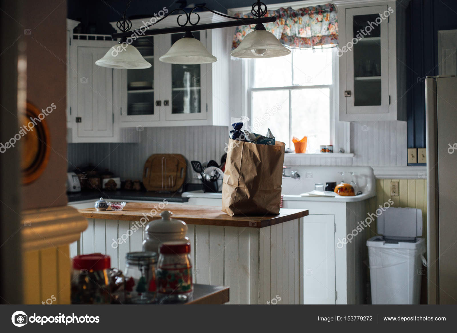Artisan Paper Bag With Groceries In White Kitchen Stock Photo