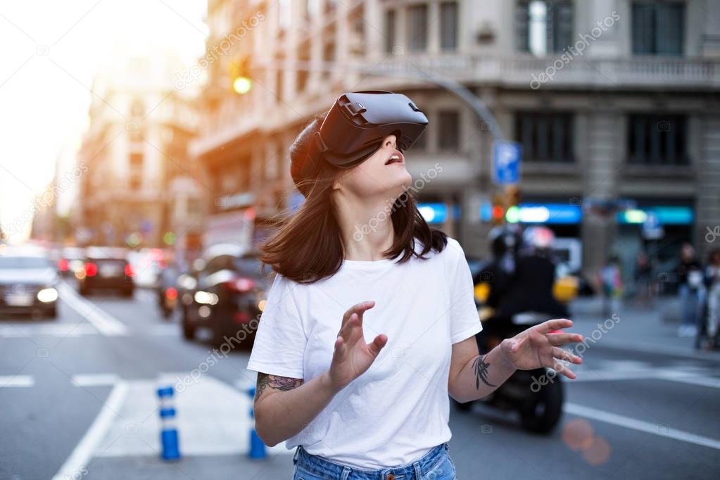 Young cute girl uses virtual reality