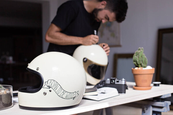 Calligraphy artist customizes motorbike helmet