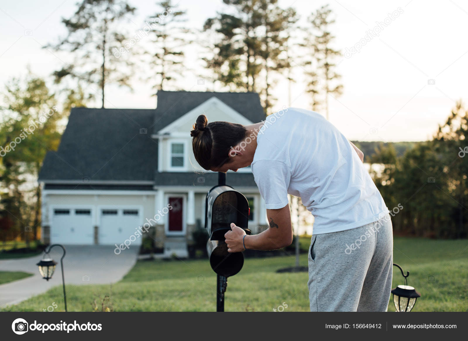Guy checking mailbox Stock Photo by ©derepente 156649412