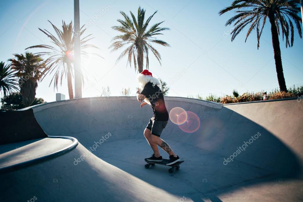 Santa Claus riding skateboard