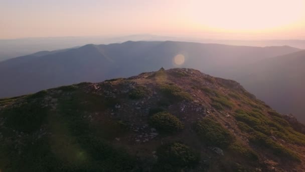 Drone video of sunset over mountain top — Stock Video