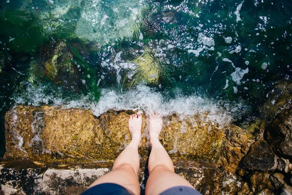 POV shot of female feet and legs in water — Stock Photo, Image