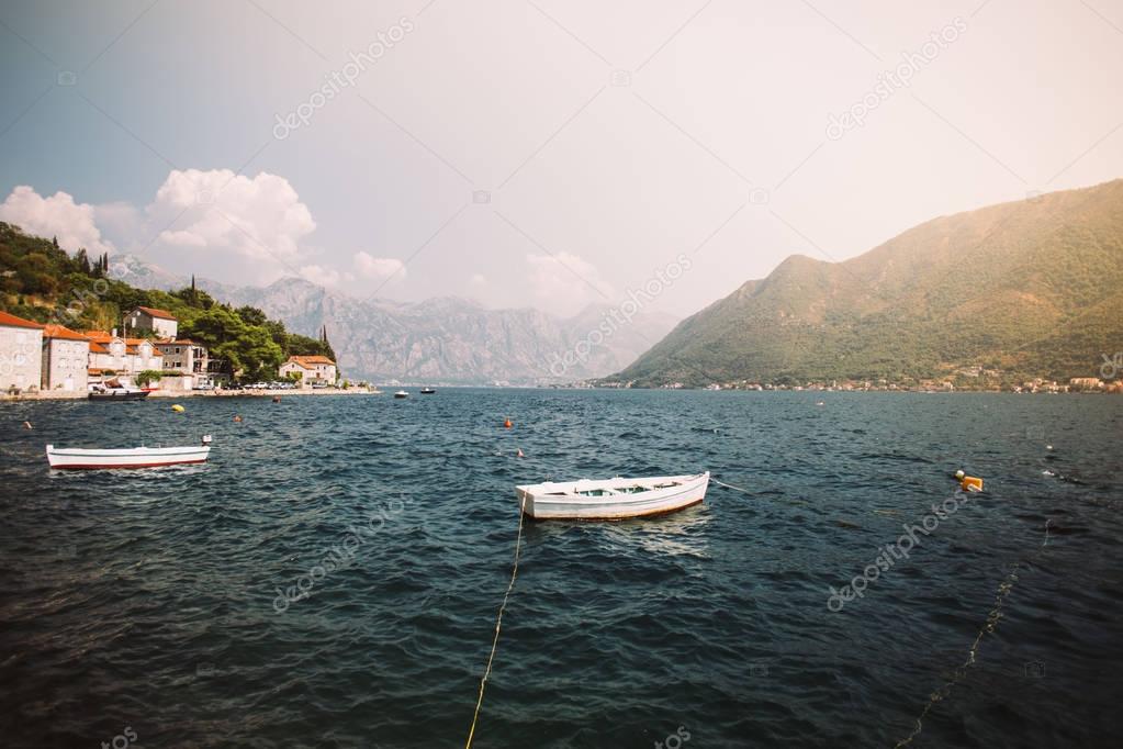 Film look of bay with docked boats