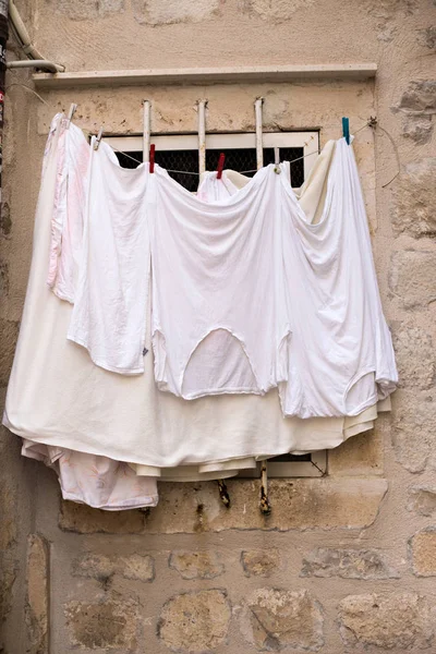 Fresh white clothes after wash — Stock Photo, Image