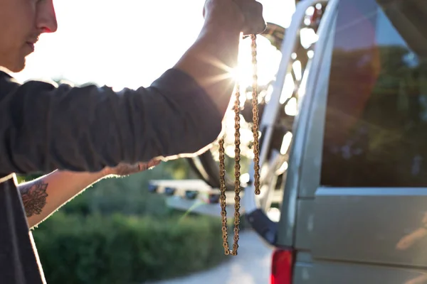 Man works on bicycle chain — Stock Photo, Image