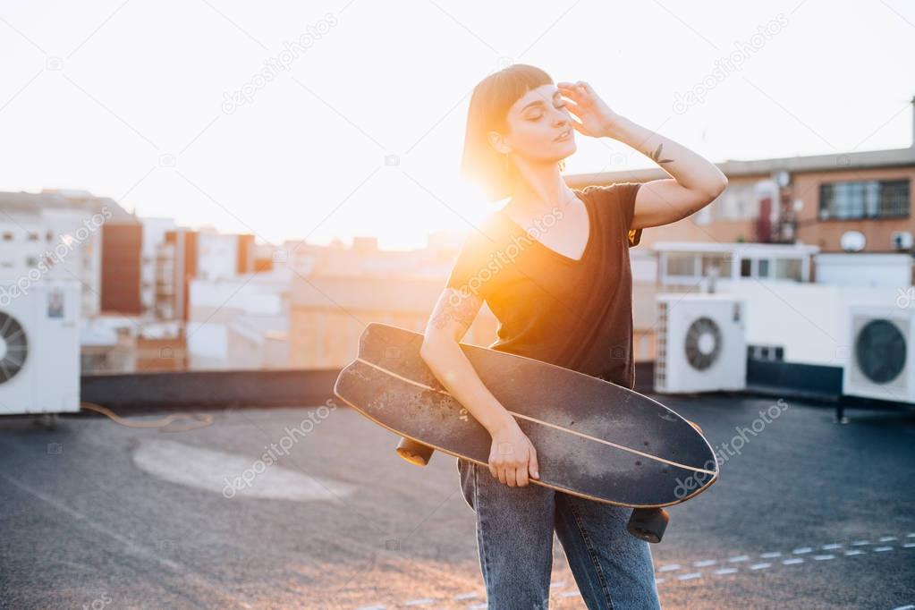hipster woman with longboard