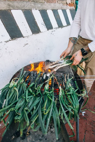Man White Tshirt Arm Tattoos Makes Barbecue Grill Spring Onions — Stock Photo, Image