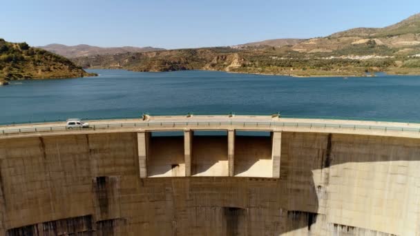 Airial drone shot of beautiful dam water and road — Stok Video