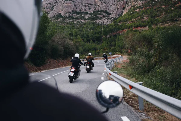 Group of motorcycle bikers on mountain road