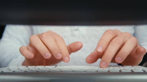 Male hands type on desktop keyboard at home — Stock Video
