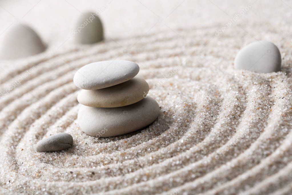 Japanese zen garden meditation for concentration and relaxation sand for harmony and balance in pure simplicity - macro lens shot