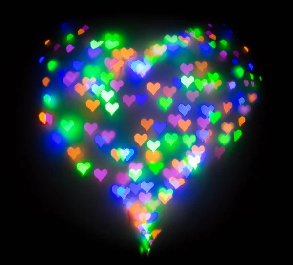 五颜六色的闪光形成了心脏, 散在心脏的形状 — 图库照片