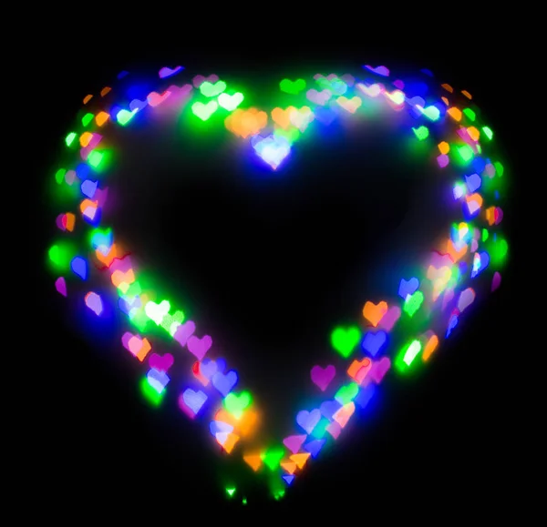 Kolorowy brokat tworzą serce, bokeh w kształcie serca — Zdjęcie stockowe