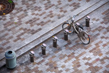 Aerial view. Modern small cobbled square with parking bikes, bic clipart