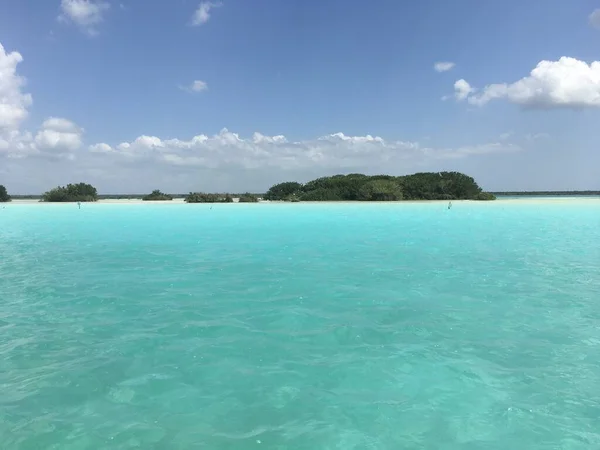 Beautiful ocean view with clean blue turquoise water, sunny day. Amazing background of island, Caribbean, Lagoon Bacalar. Calm secluded place without people, paradise