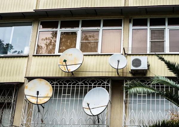 Balconies with satellite dishes and air conditioning — Stock Photo, Image
