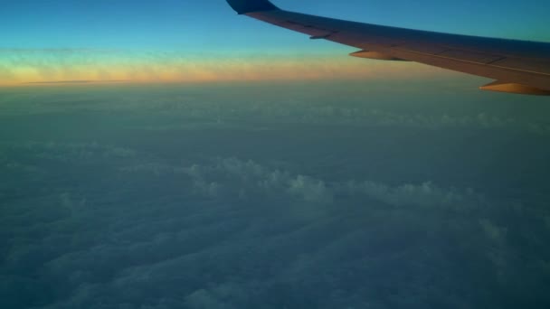 The view from the plane. White clouds and blue sky. 4K resolution. Flight at high altitude. Troposphere. Flight at a height of 10 to 12 kilometers. Wing of airplane in flight. beautiful view — Stock Video