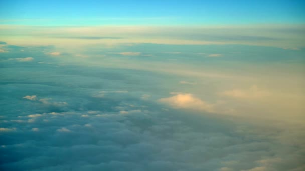 The view from the plane. White clouds and blue sky. 4K resolution. Flight at high altitude. Troposphere. Flight at a height of 10 to 12 kilometers. Beautiful view. — Stock Video