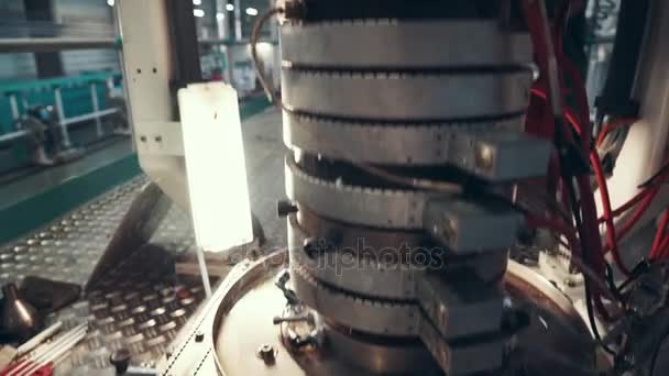 Production department at the company. Production of the film for sausages. Melting and cooling. Rotating elements. High-tech equipment. Items of production equipment close-up. Warm color grading — Stock Video