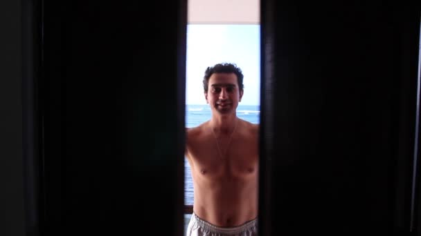 Man Open Door and Inviting Someone to Paradise — Stock Video