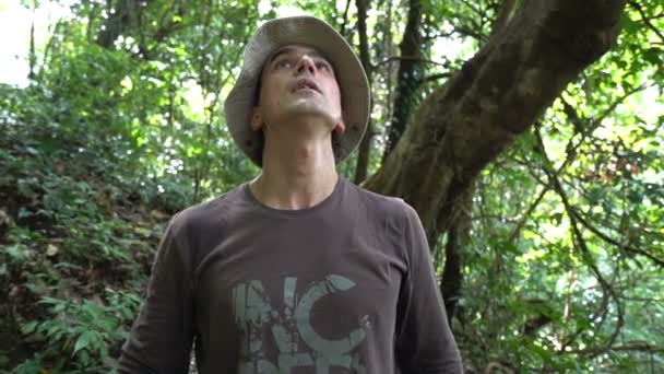 Scared Man in Jungle Looking Around he get lost and feel wild animal searching for thim bad fear condition survival training adrenaline rush extreme adventures challenge concept — Stock Video