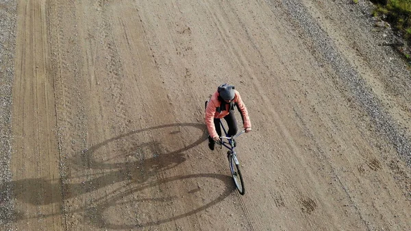 cycling road bike, woman bicycle rider from top, aerial view, shot from above, man cyclist on empty