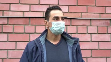 Masked man wearing boxing gloves, getting crazy, show fuck off to camera, hypochondriac, paranoia