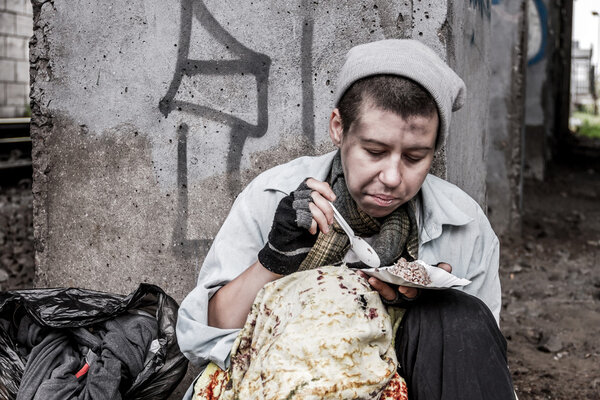 Homeless woman eating
