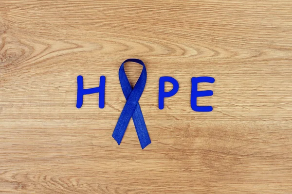 Concepto Enfermedad Oncológica Palabra Esperanza Escrita Con Una Cinta Azul — Foto de Stock