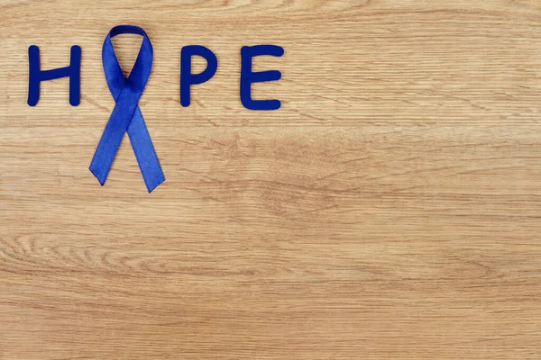 Conceito Doença Oncológica Palavra Esperança Escrito Com Uma Fita Azul — Fotografia de Stock