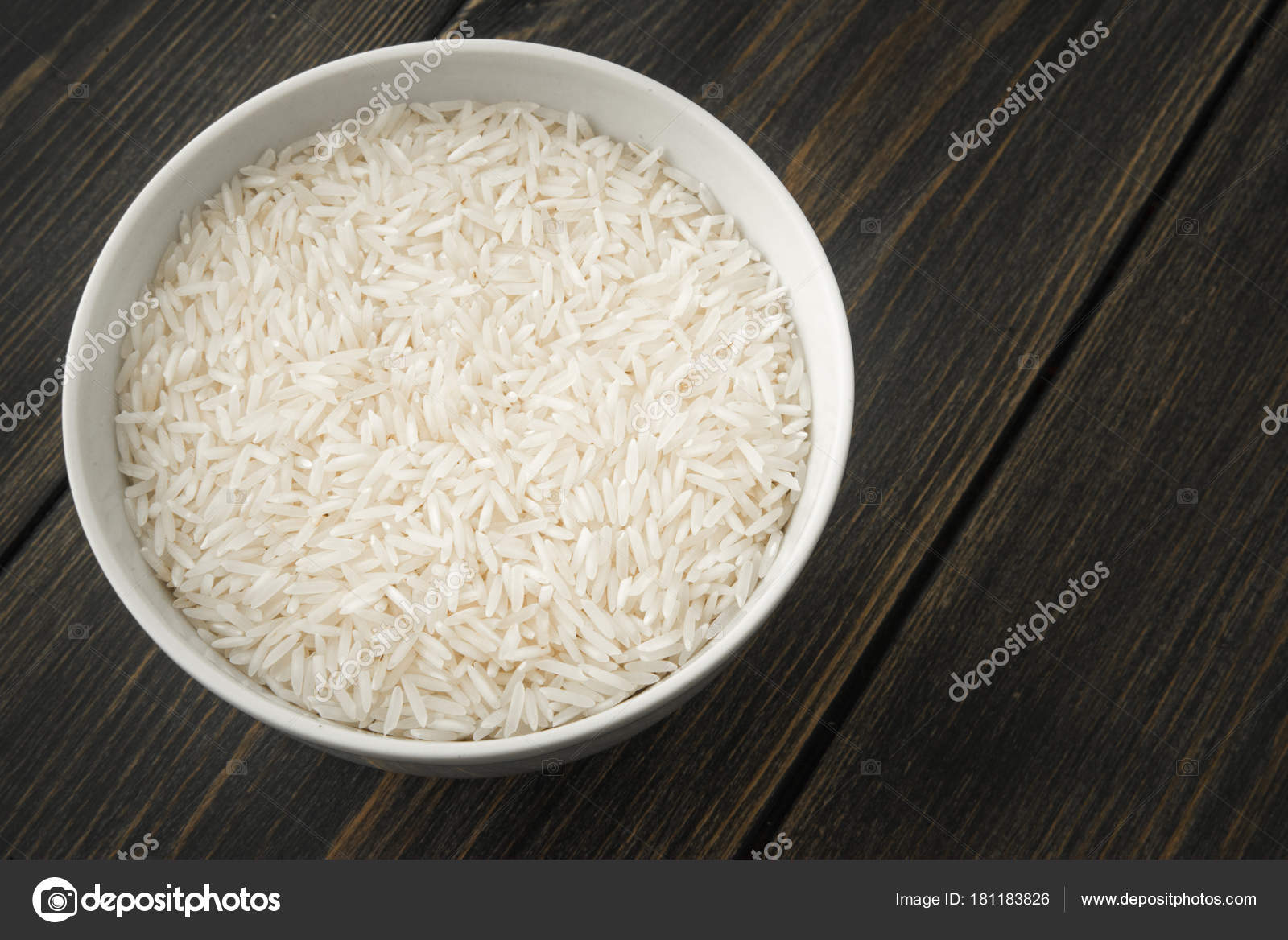 Raw Basmati rice paddy in a white porcelain bowl Stock Photo by ...