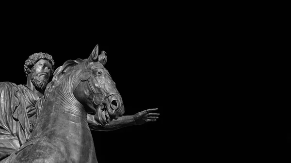 Marcus Aurelius ancient roman emperor bronze equestrian statue at the center of Capitol Hill Square in Rome (Black and White with copy space)